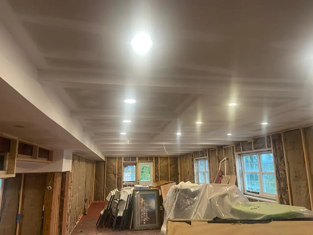 Finished drywall ceiling with recessed lights in a basement remodel by B&B Drywall in Northern Virginia