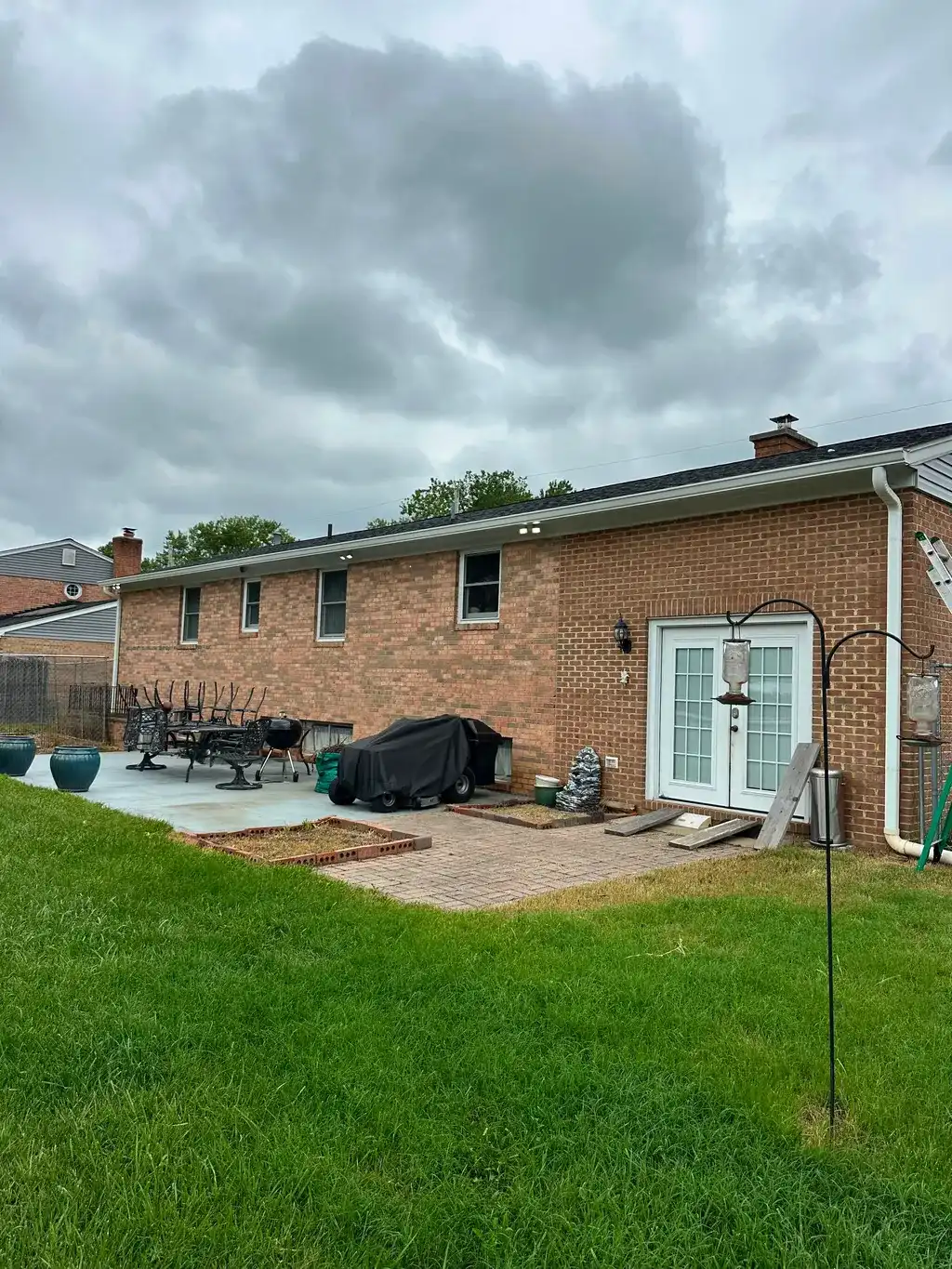 Rear of a brick home with patio in Northern Virginia
