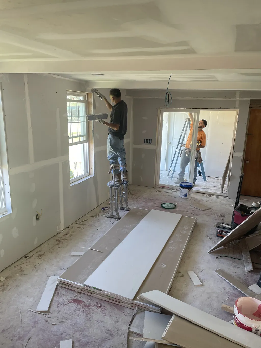 B&B Drywall crew hanging and finishing drywall in a home remodel